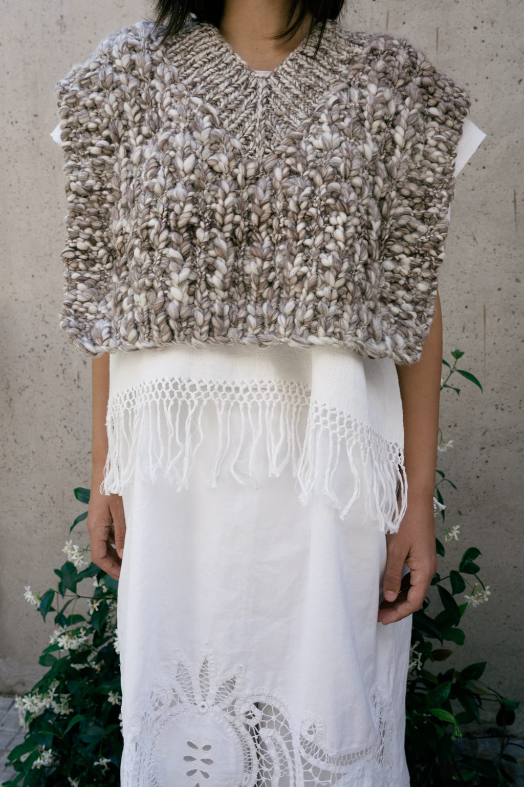 Vest Higo in soft stone grey — hand-knitted merino wool.