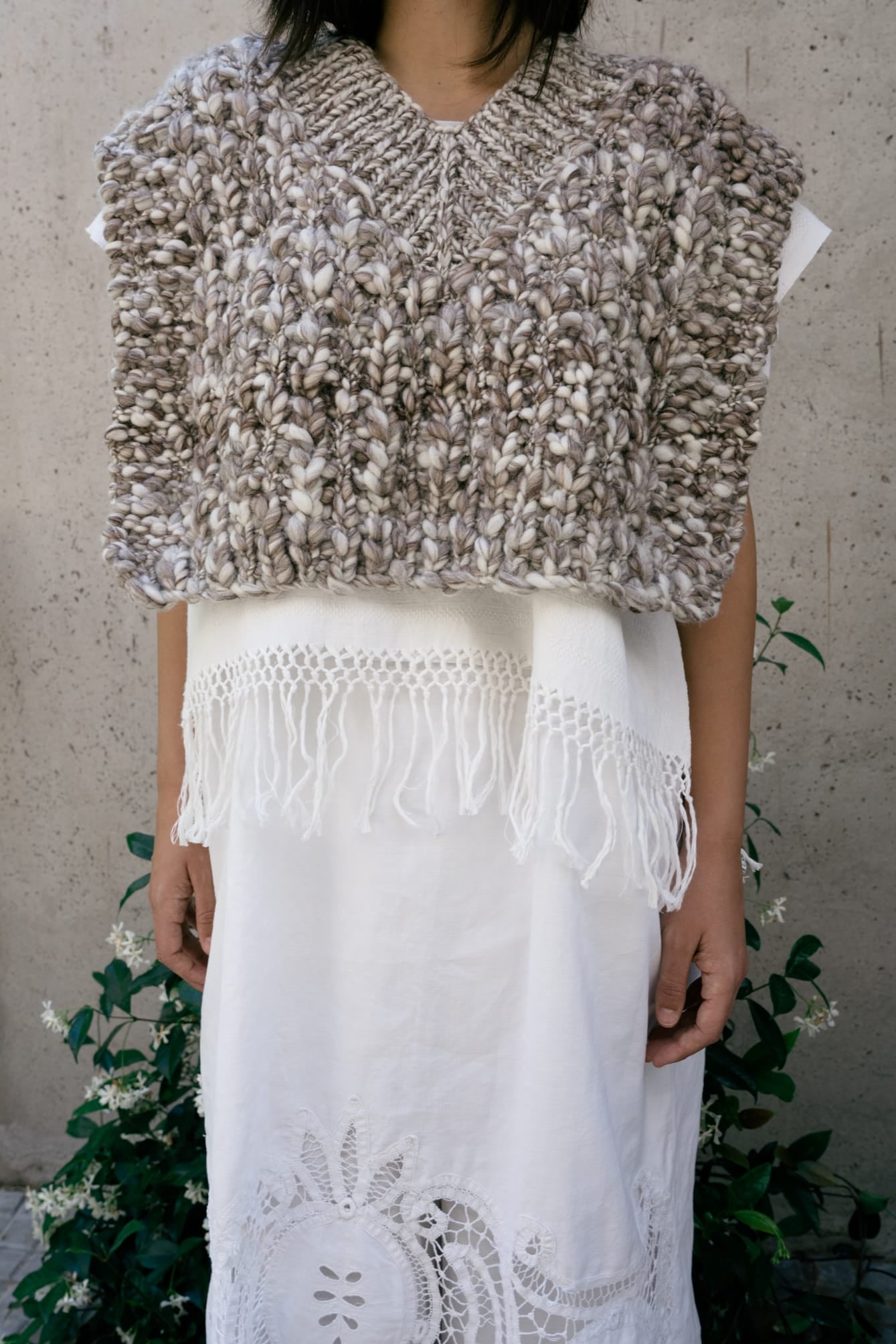 Vest Higo in soft stone grey — hand-knitted merino wool.