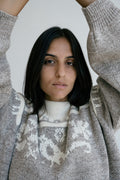 Criollo Jumper in soft stone grey — hand-knitted merino wool.