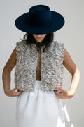Fumo Vest in soft stone grey — hand-knitted merino wool.