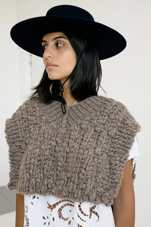 Vest Higo detail — hand-knitted merino wool texture up close.
