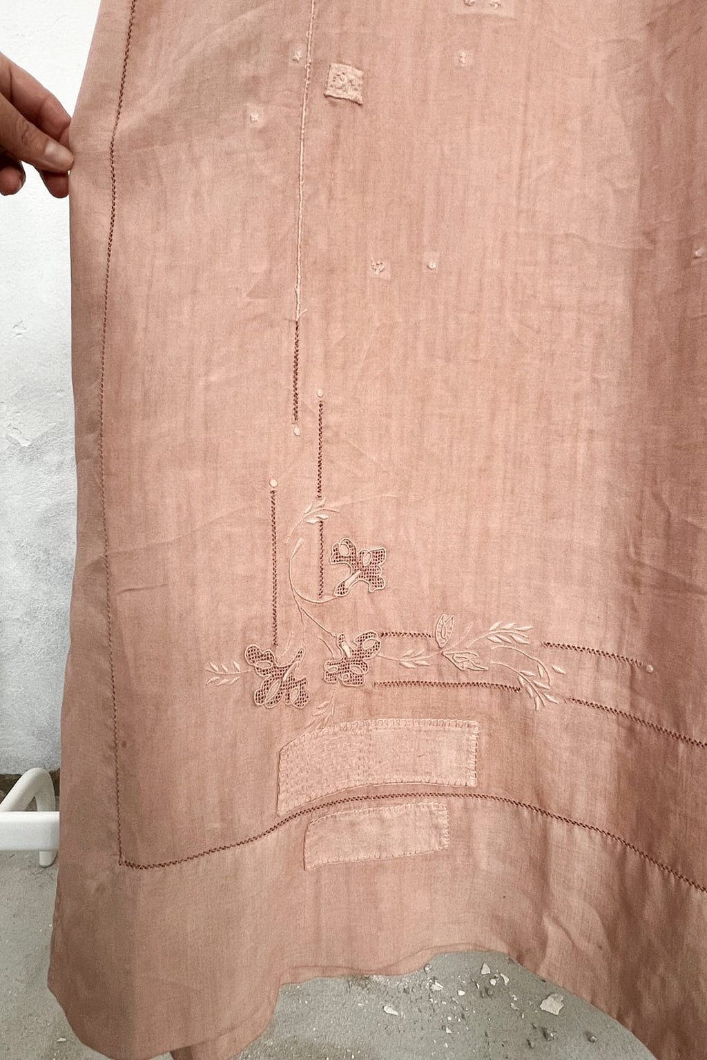 Details of a vintage fabric, hand dyed with avocado. Hand Embroided. 