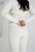 Polo Legging in soft ivory — hand-knitted merino wool.