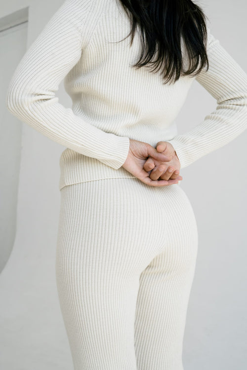 Polo Legging in soft ivory — hand-knitted merino wool.