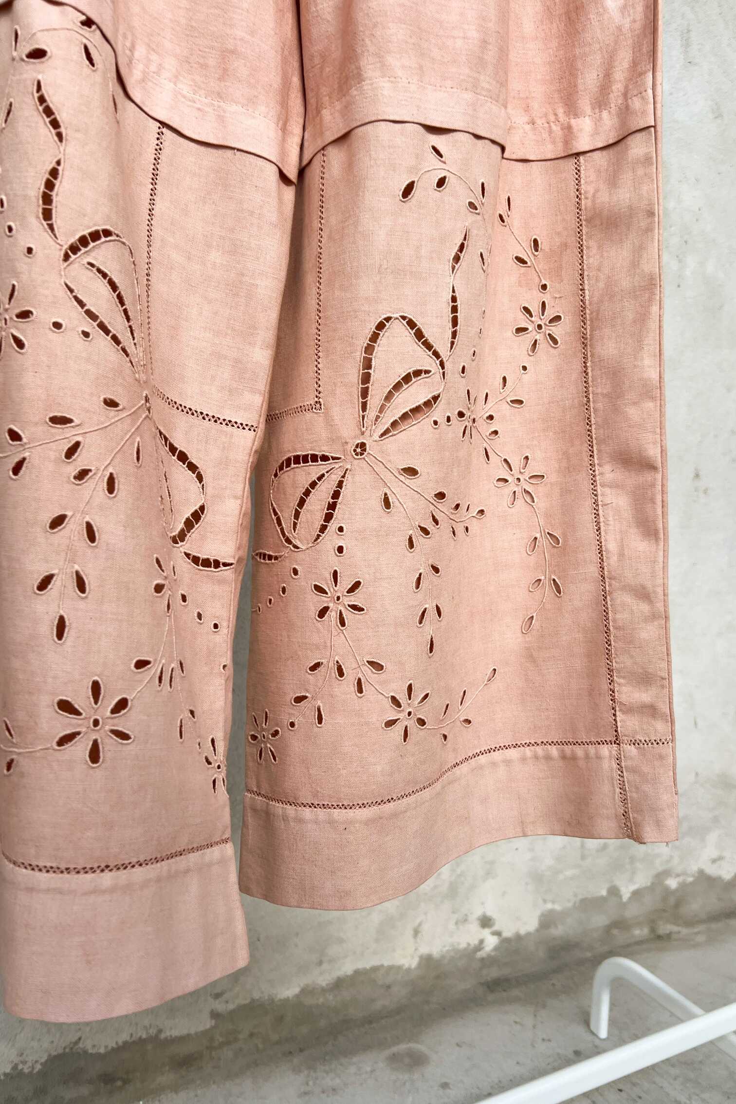 floral cutwork embroidery on vintage textile. 