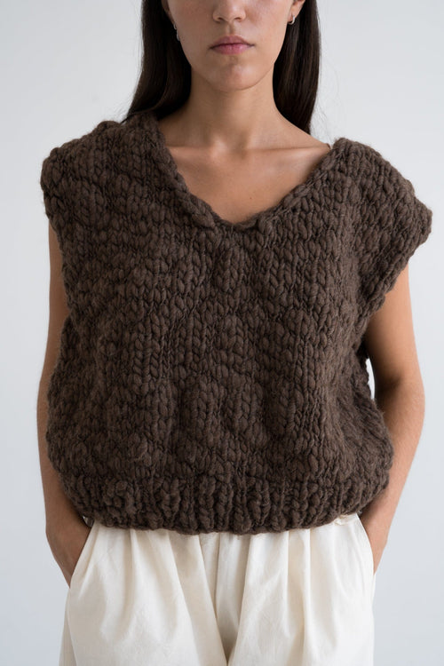 Acacia Vest detail — hand-knitted wool texture up close.