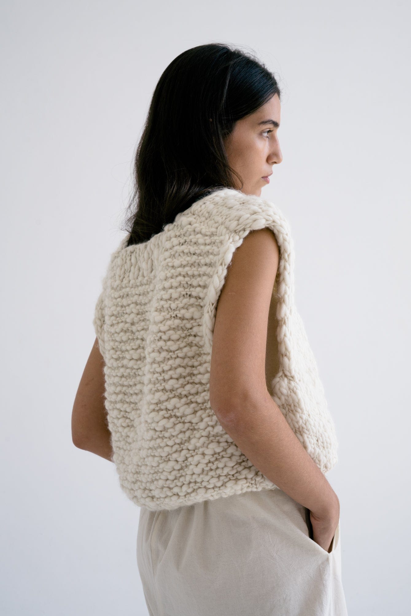 Acacia Vest detail — hand-knitted merino wool texture up close.