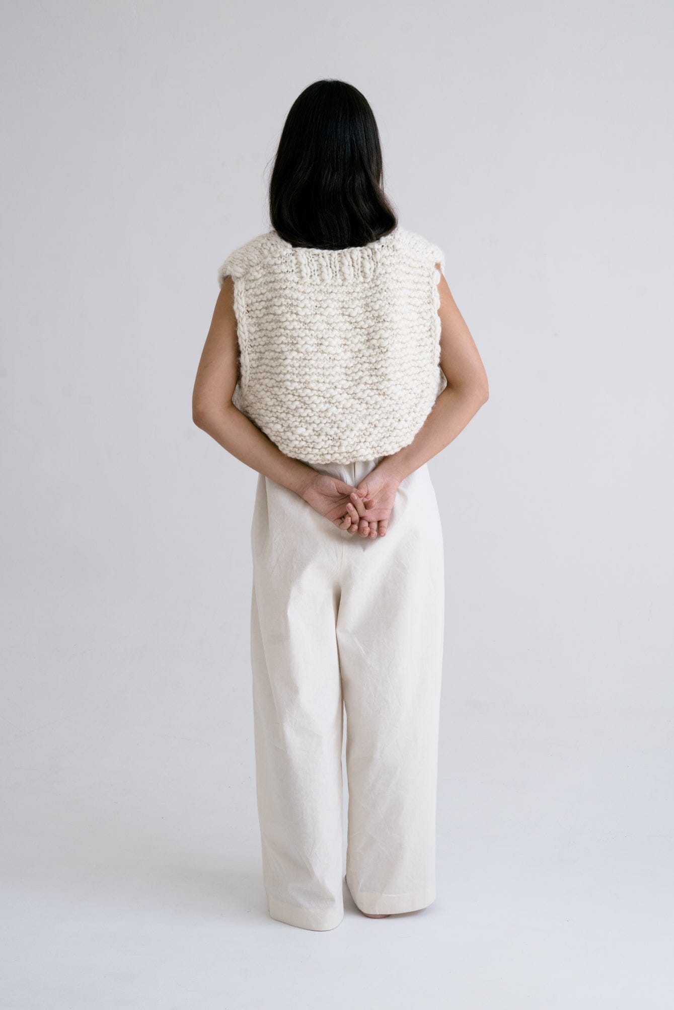 Acacia Vest in soft ivory — hand-knitted merino wool, alternate view.