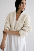 Boj Cardigan in soft ivory — hand-knitted merino wool.