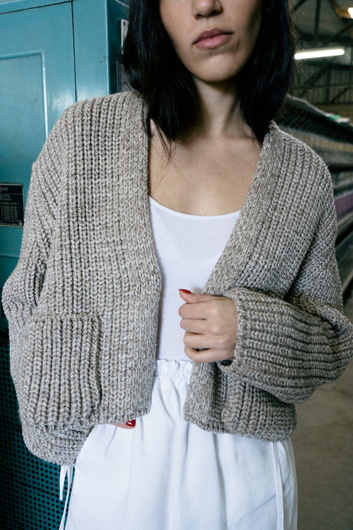 Boj Cardigan in soft stone grey — hand-knitted merino wool.