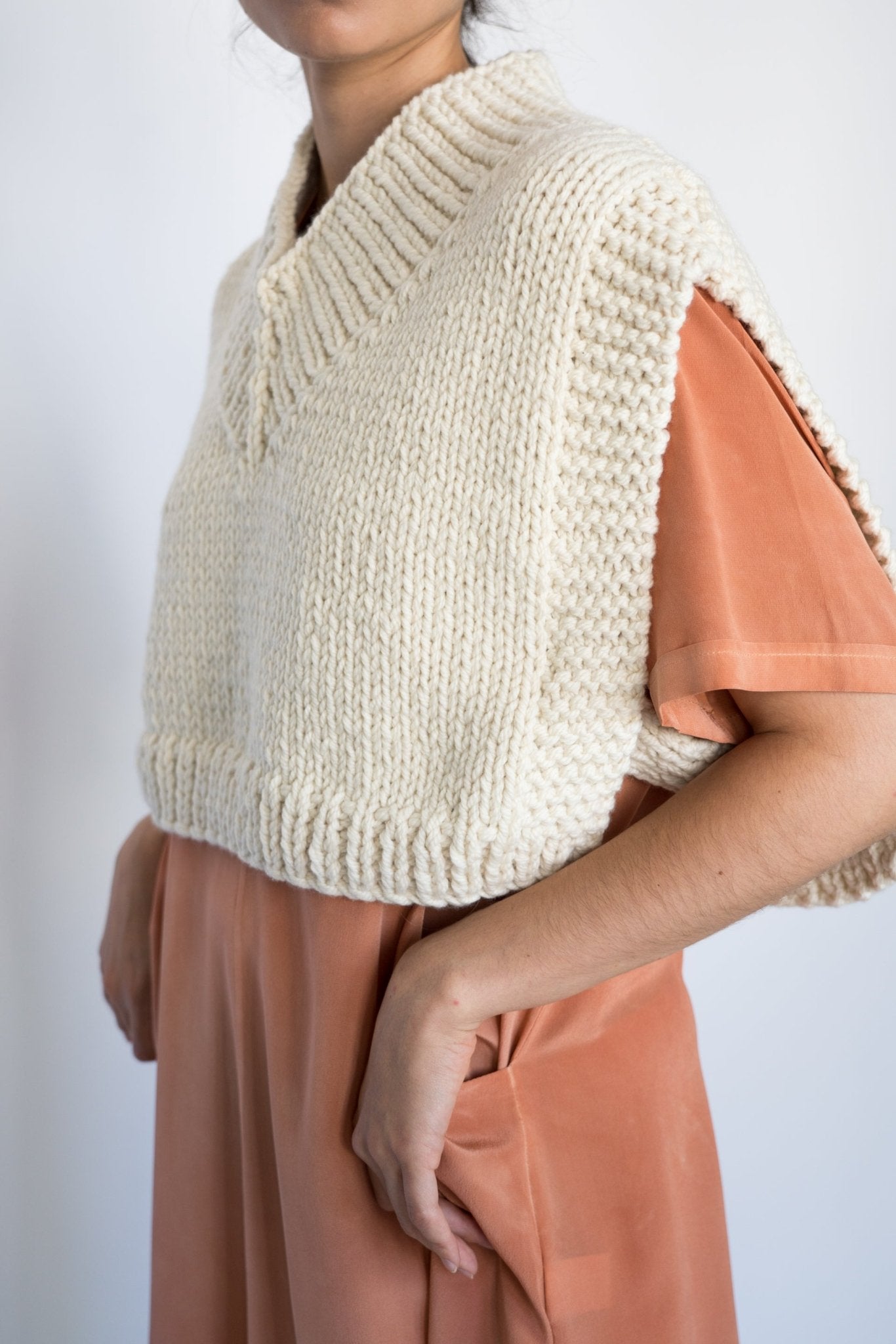 Bunon Vest in soft ivory — hand-knitted merino wool, alternate view.