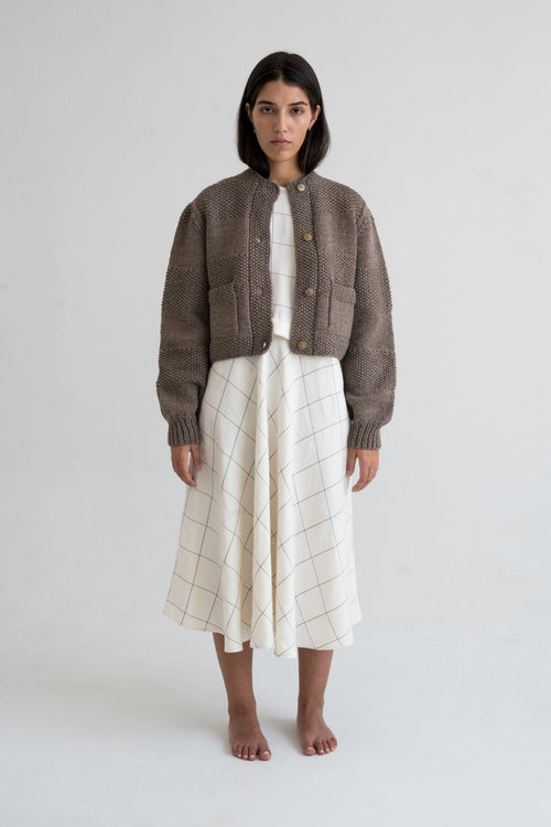 Caoba Cardigan detail — hand-knitted merino wool texture up close.