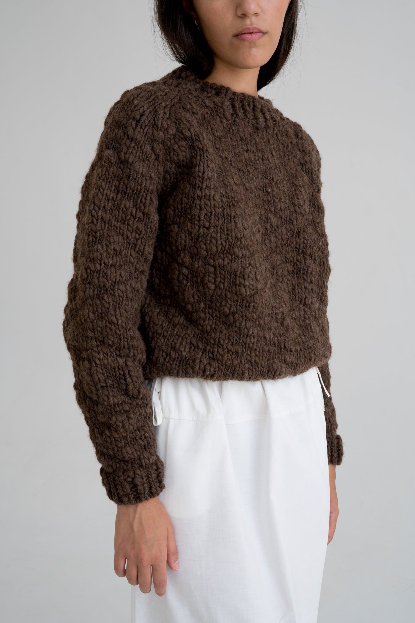 Caven Jumper detail — hand-knitted wool texture up close.
