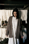 Cedro Cardigan in warm brown — hand-knitted merino wool.