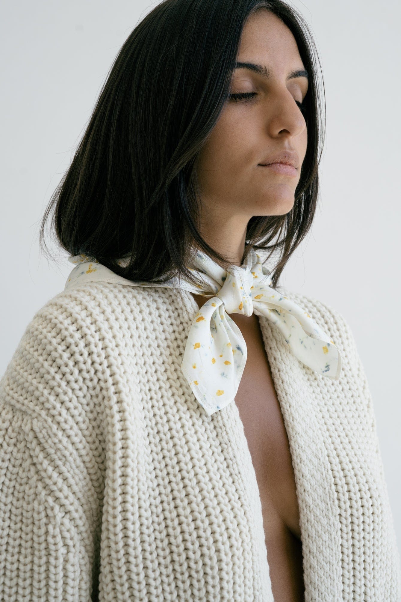 Cedro Cardigan full view — hand-knitted merino wool, styled on figure.