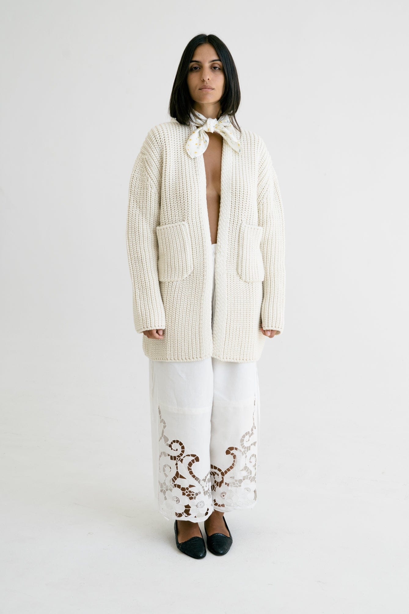 Cedro Cardigan detail — hand-knitted merino wool texture up close.