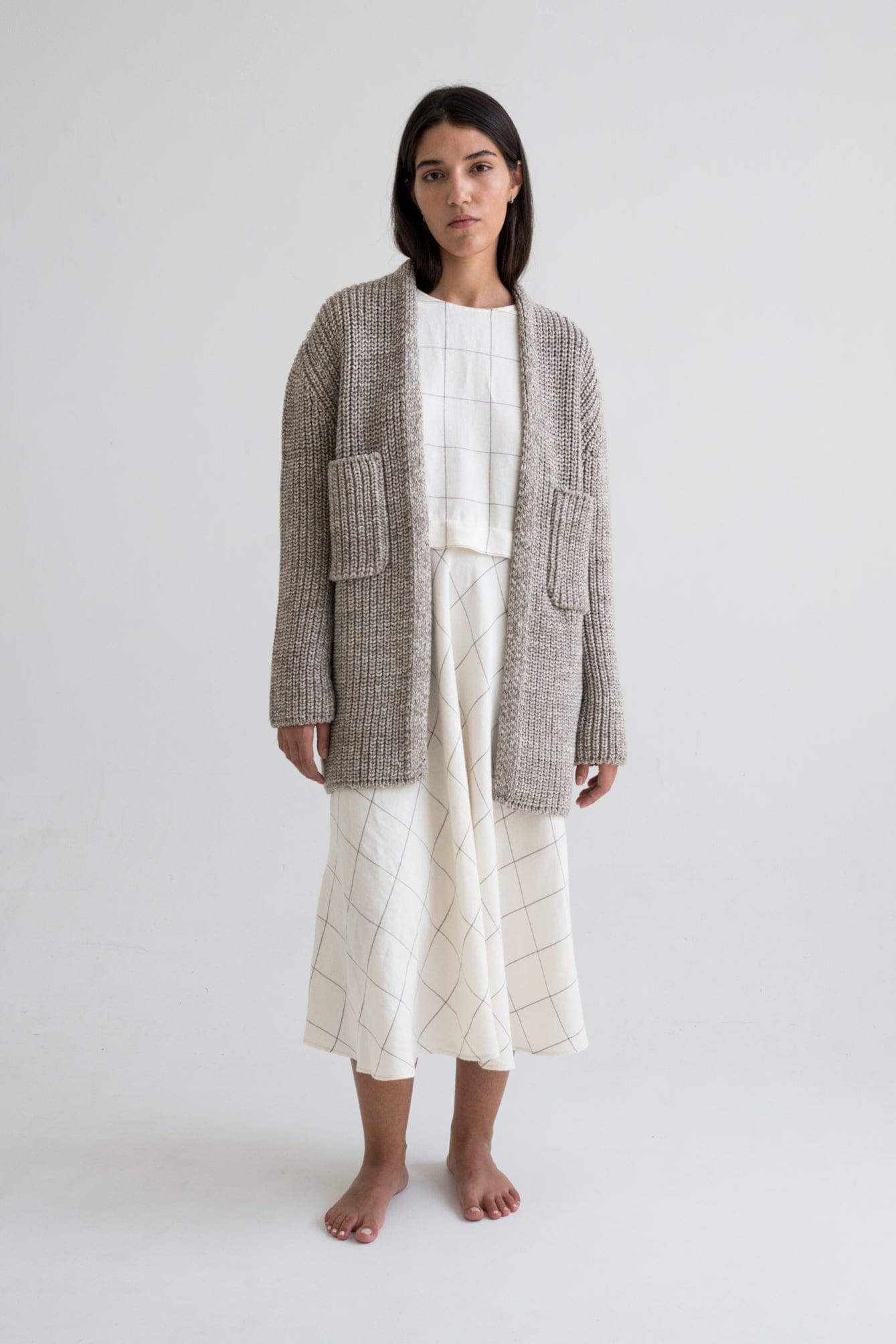 Cedro Cardigan full view — hand-knitted merino wool, styled on figure.