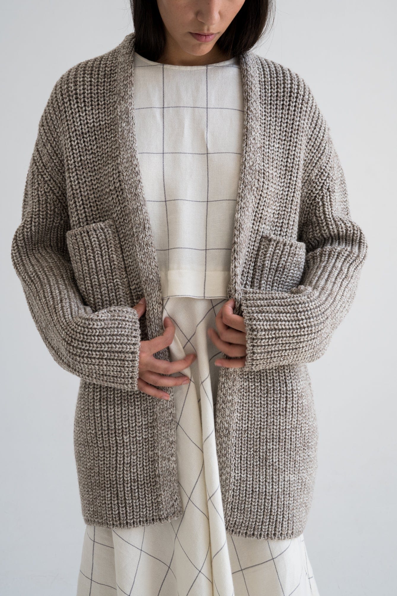 Model wearing Cedro Cardigan in soft stone grey — relaxed slow-fashion styling.