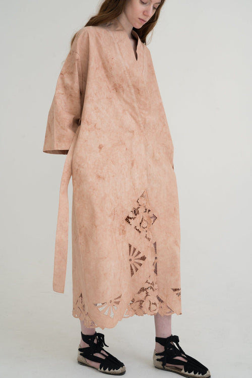 Cina Robe Dress detail — avocado pits and skins pattern visible up close.