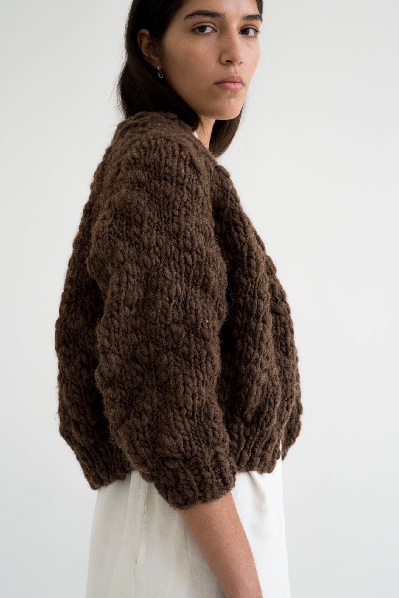 Jacaranda Cardigan detail — hand-knitted wool texture up close.