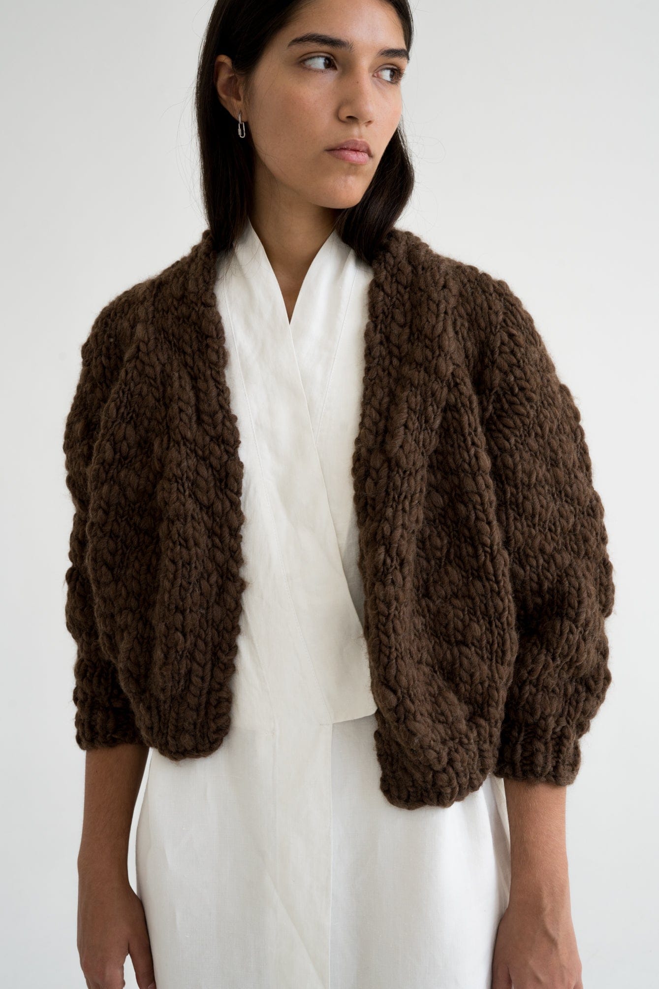 Jacaranda Cardigan in earth brown — hand-knitted wool.