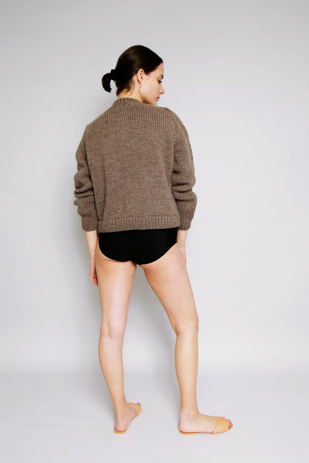 Molle Jumper full view — hand-knitted merino wool, styled on figure.