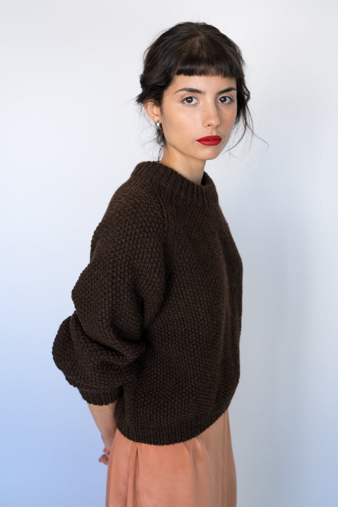 Naca Jumper in earth brown — hand-knitted wool.