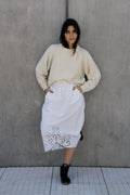 Naca Jumper in soft ivory — hand-knitted merino wool.