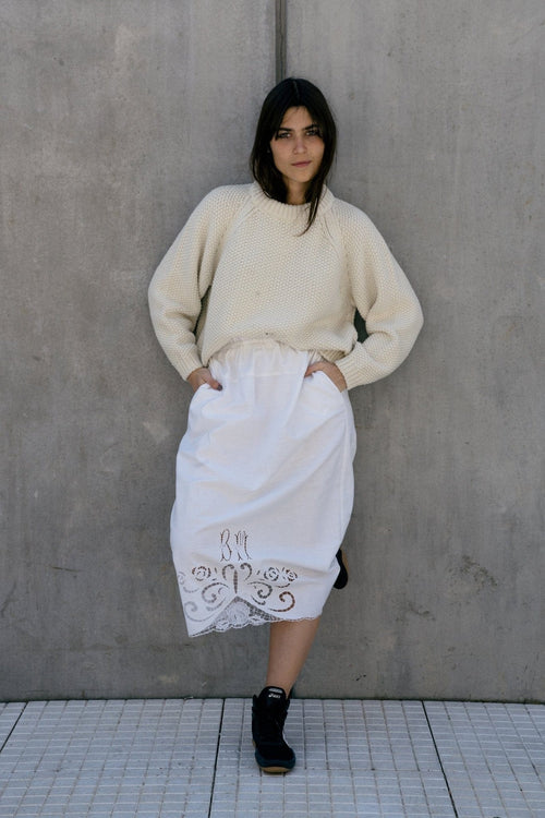 Naca Jumper in soft ivory — hand-knitted merino wool.