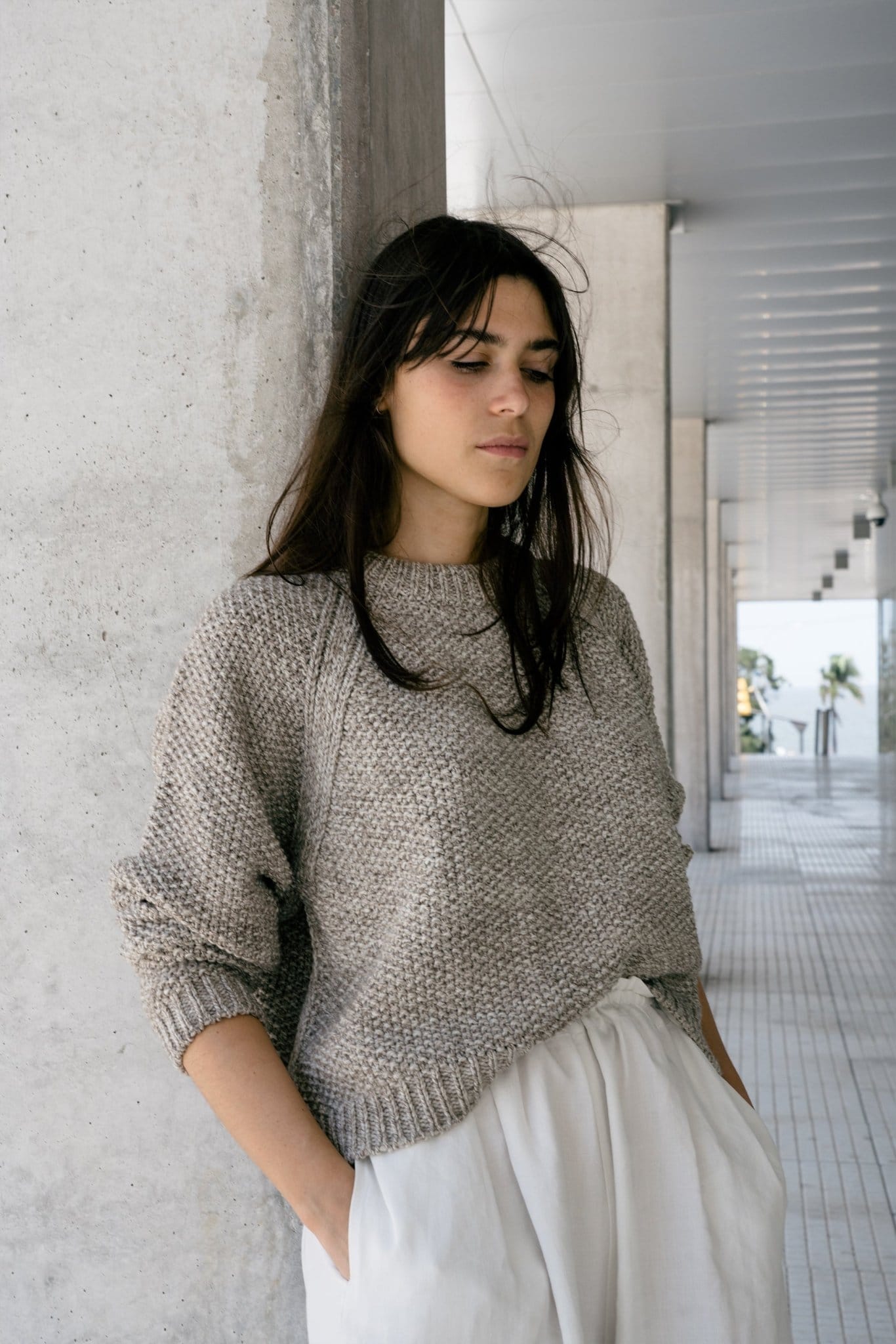 Naca Jumper full view — hand-knitted merino wool, styled on figure.