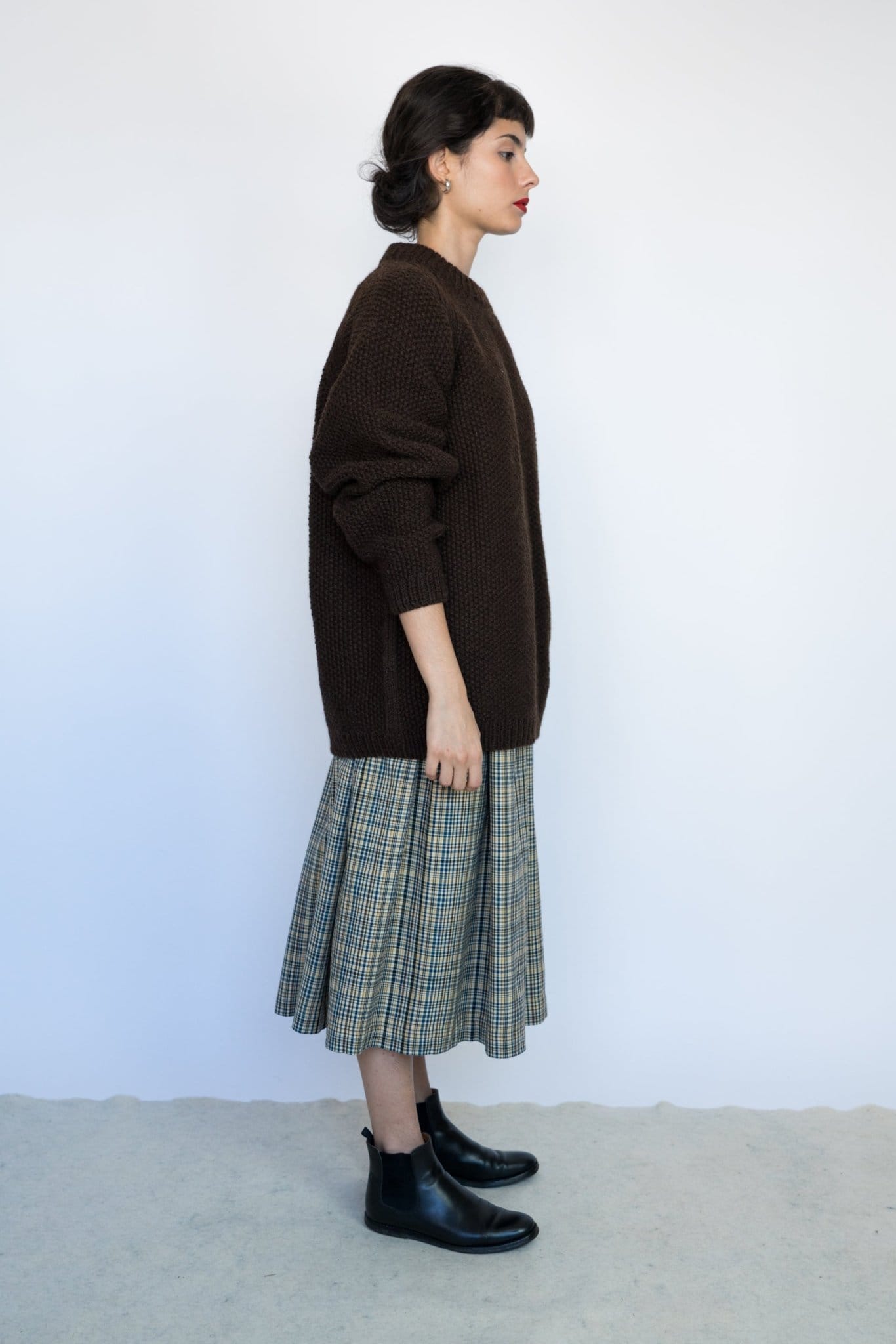 Roble Jumper full view — hand-knitted wool, styled on figure.