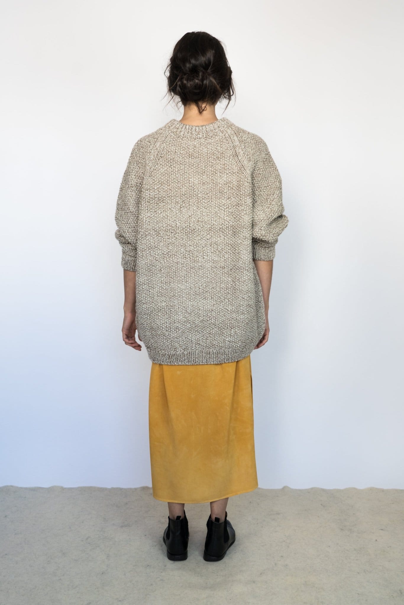 Roble Jumper full view — hand-knitted merino wool, styled on figure.