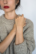 Roble Jumper in soft stone grey — hand-knitted merino wool.
