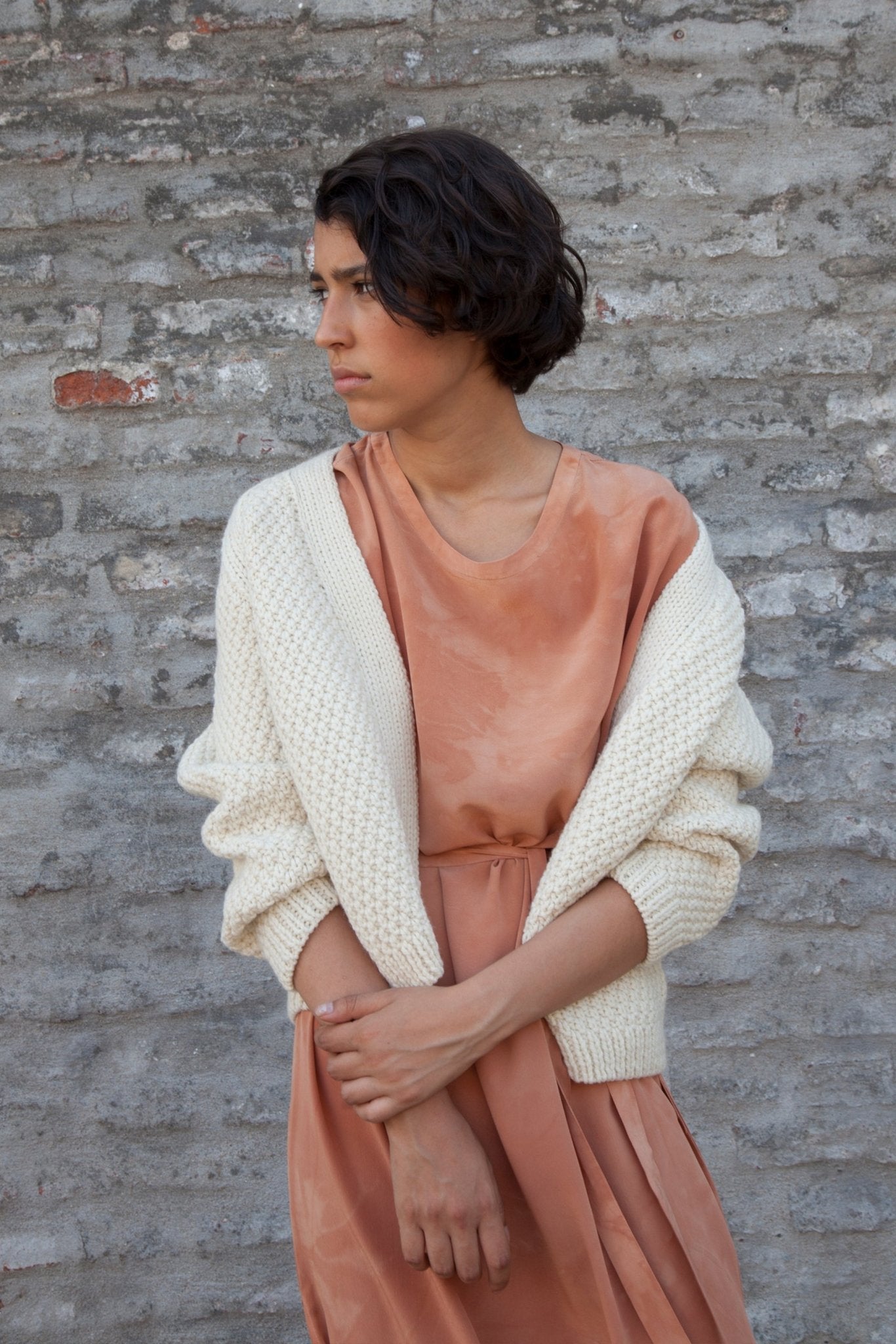 Sauco Cardigan in soft ivory — hand-knitted merino wool.