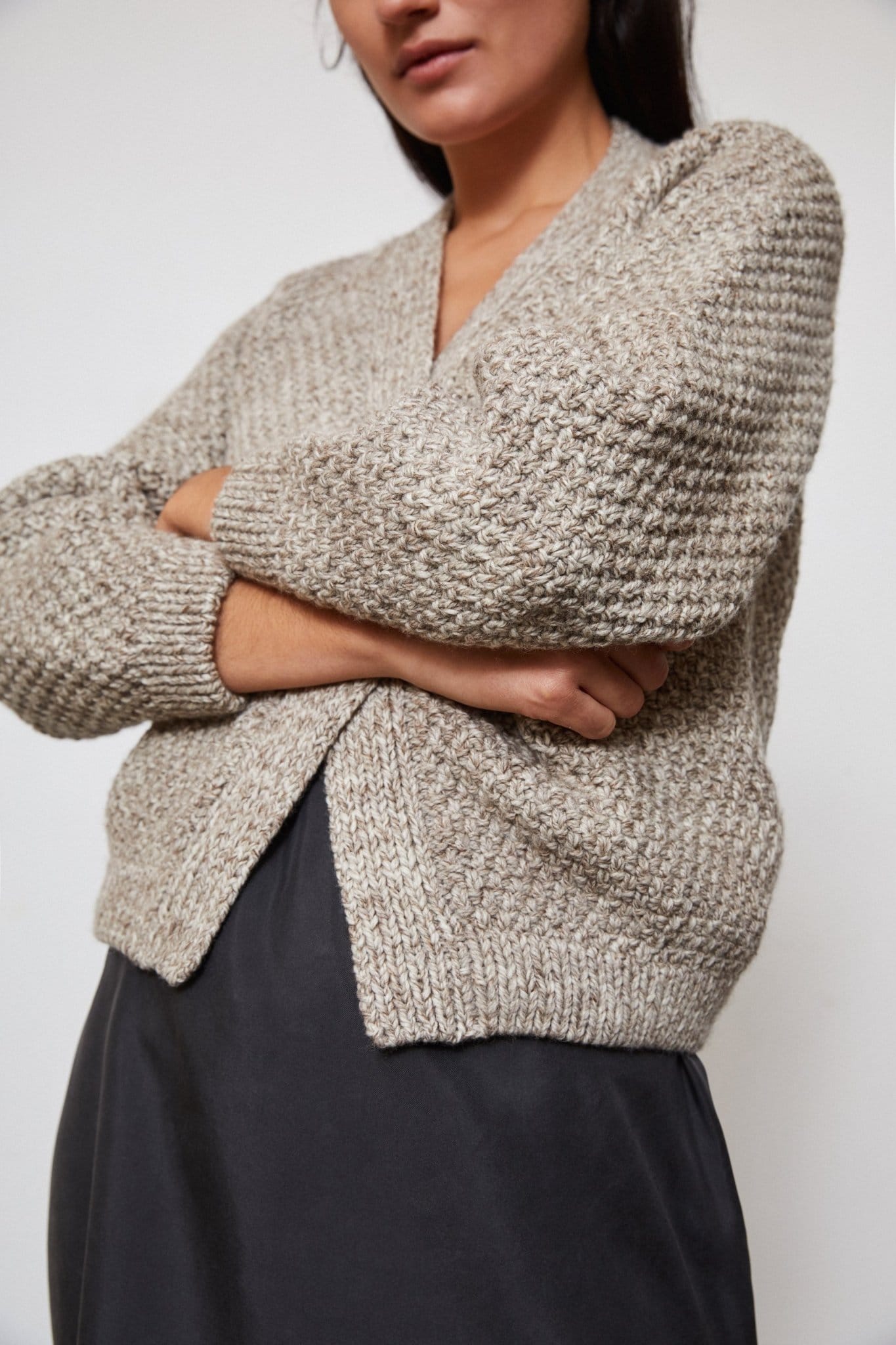 Sauco Cardigan in soft stone grey — hand-knitted merino wool, alternate view.