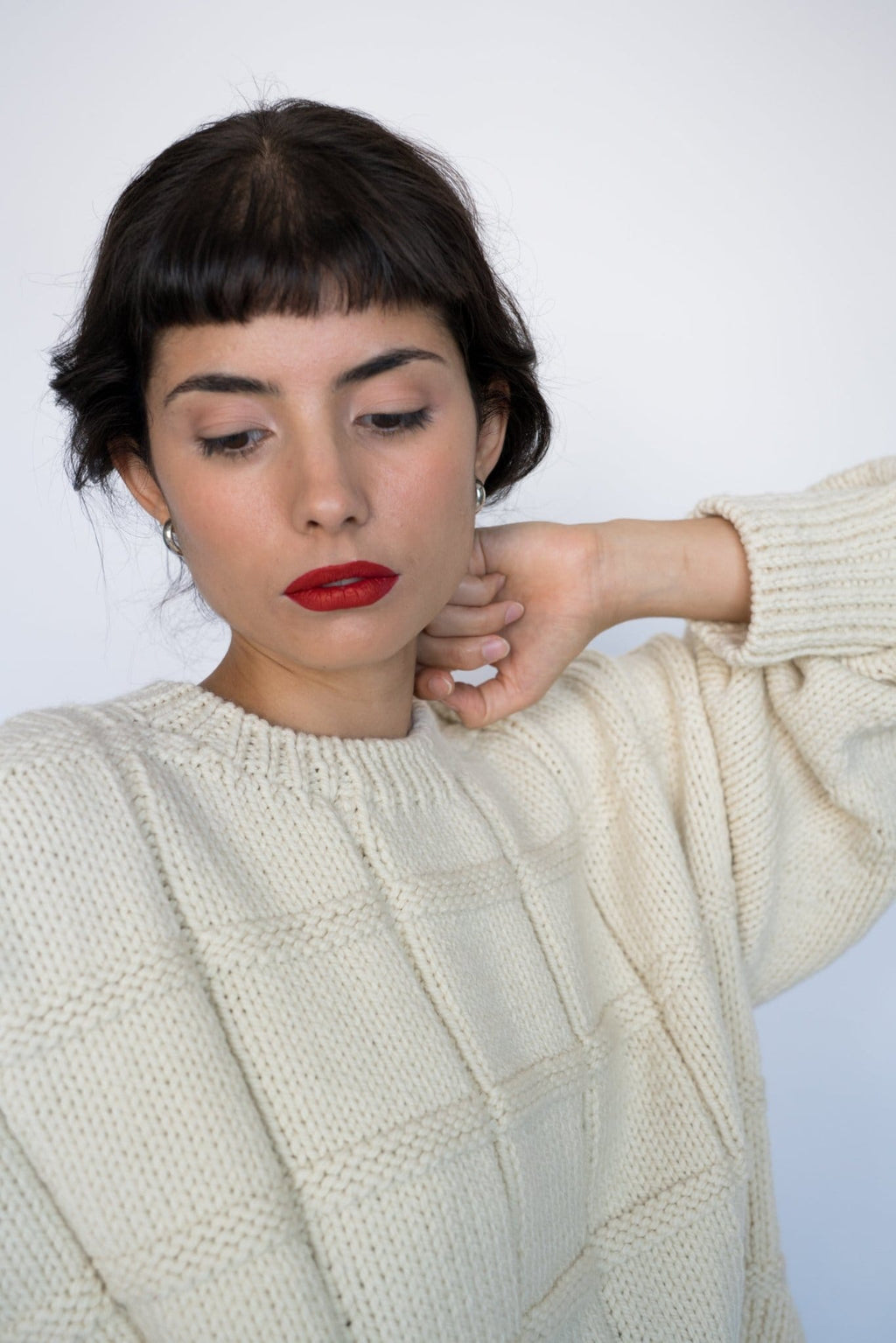 Tala Jumper full view — hand-knitted merino wool, styled on figure.