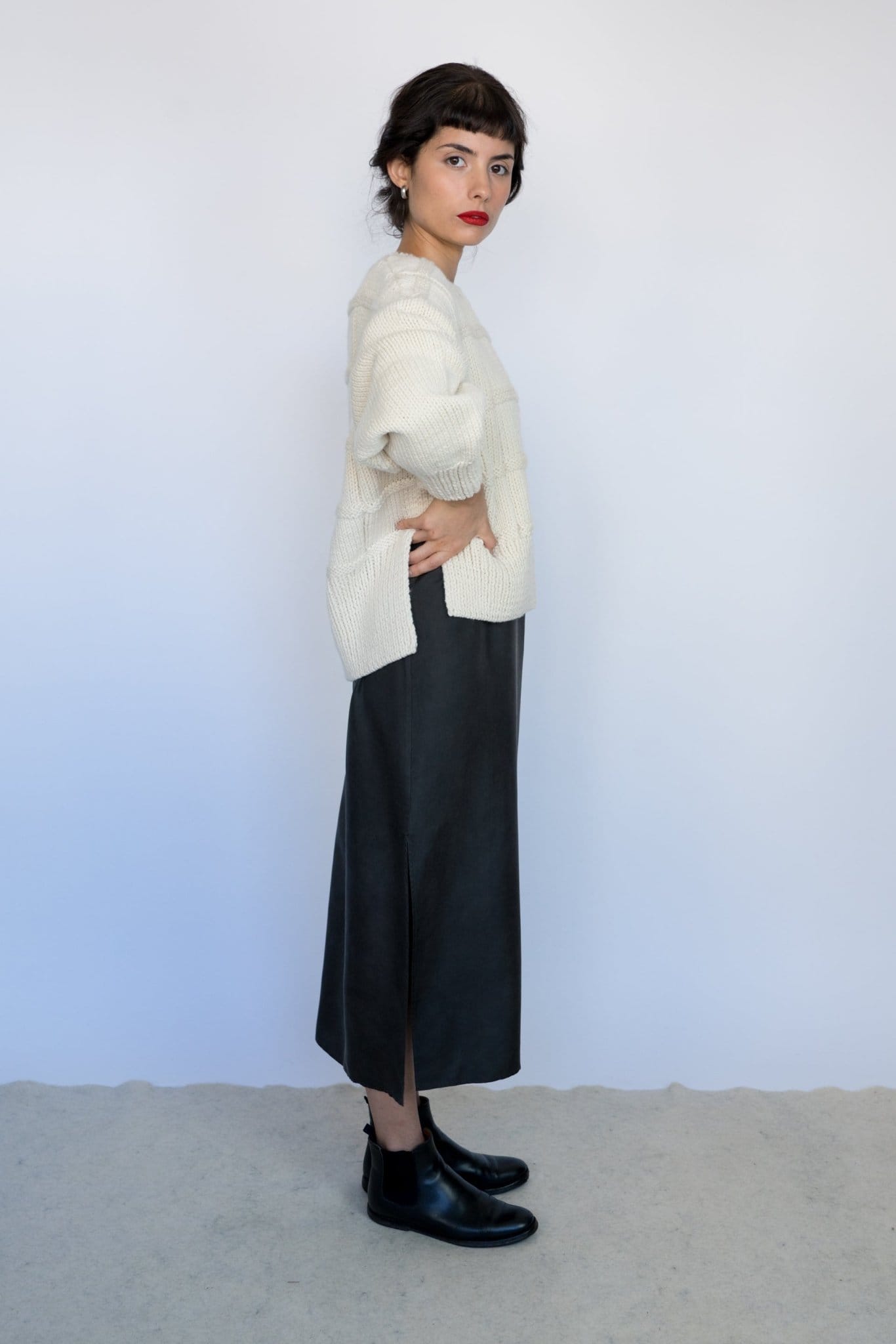 Model wearing Tala Jumper in soft ivory — relaxed slow-fashion styling.