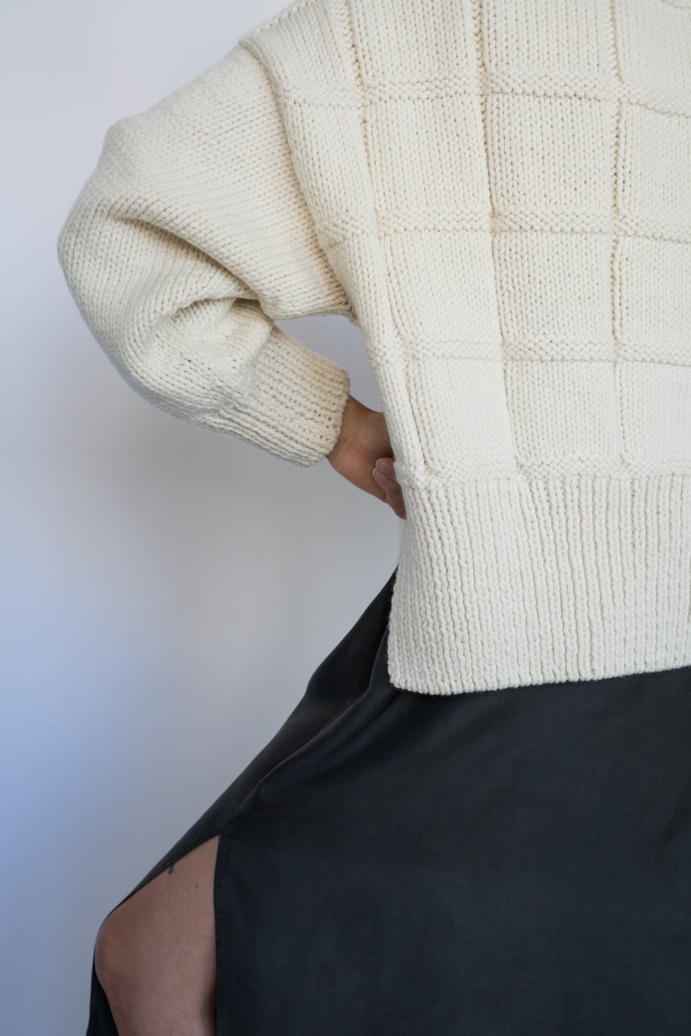 Tala Jumper in soft ivory — hand-knitted merino wool, alternate view.