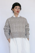 Tala Jumper in soft stone grey — hand-knitted merino wool.
