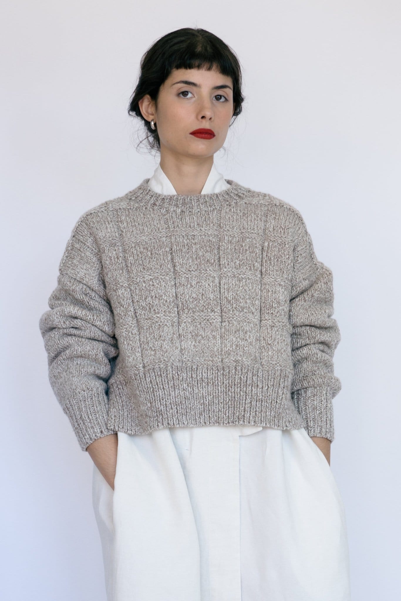 Tala Jumper in soft stone grey — hand-knitted merino wool.
