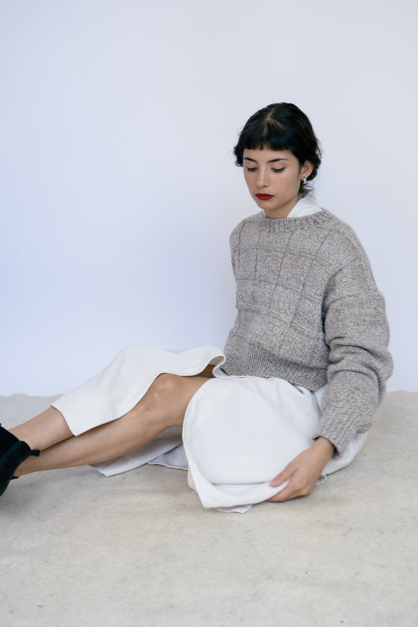 Tala Jumper full view — hand-knitted merino wool, styled on figure.