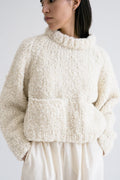 Tilo Jumper detail — hand-knitted merino wool texture up close.