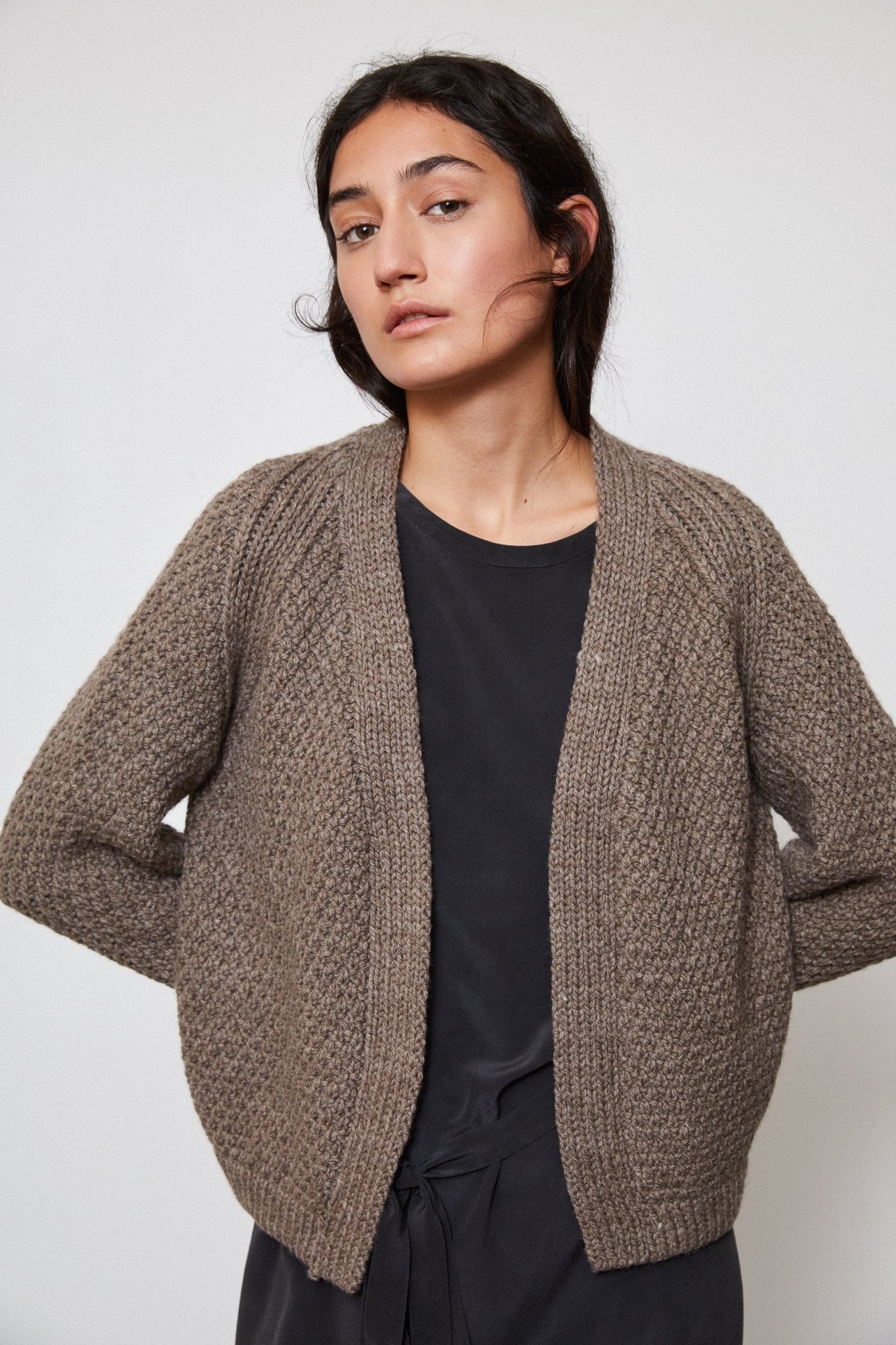 Sauco Cardigan in warm brown — hand-knitted merino wool.