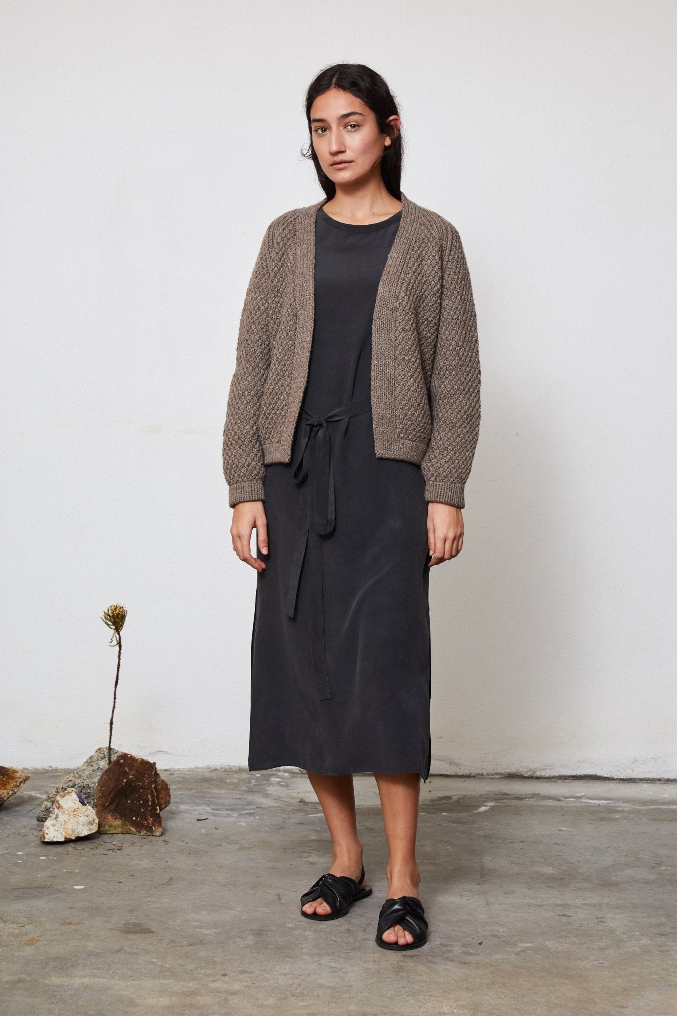 Sauco Cardigan full view — hand-knitted merino wool, styled on figure.